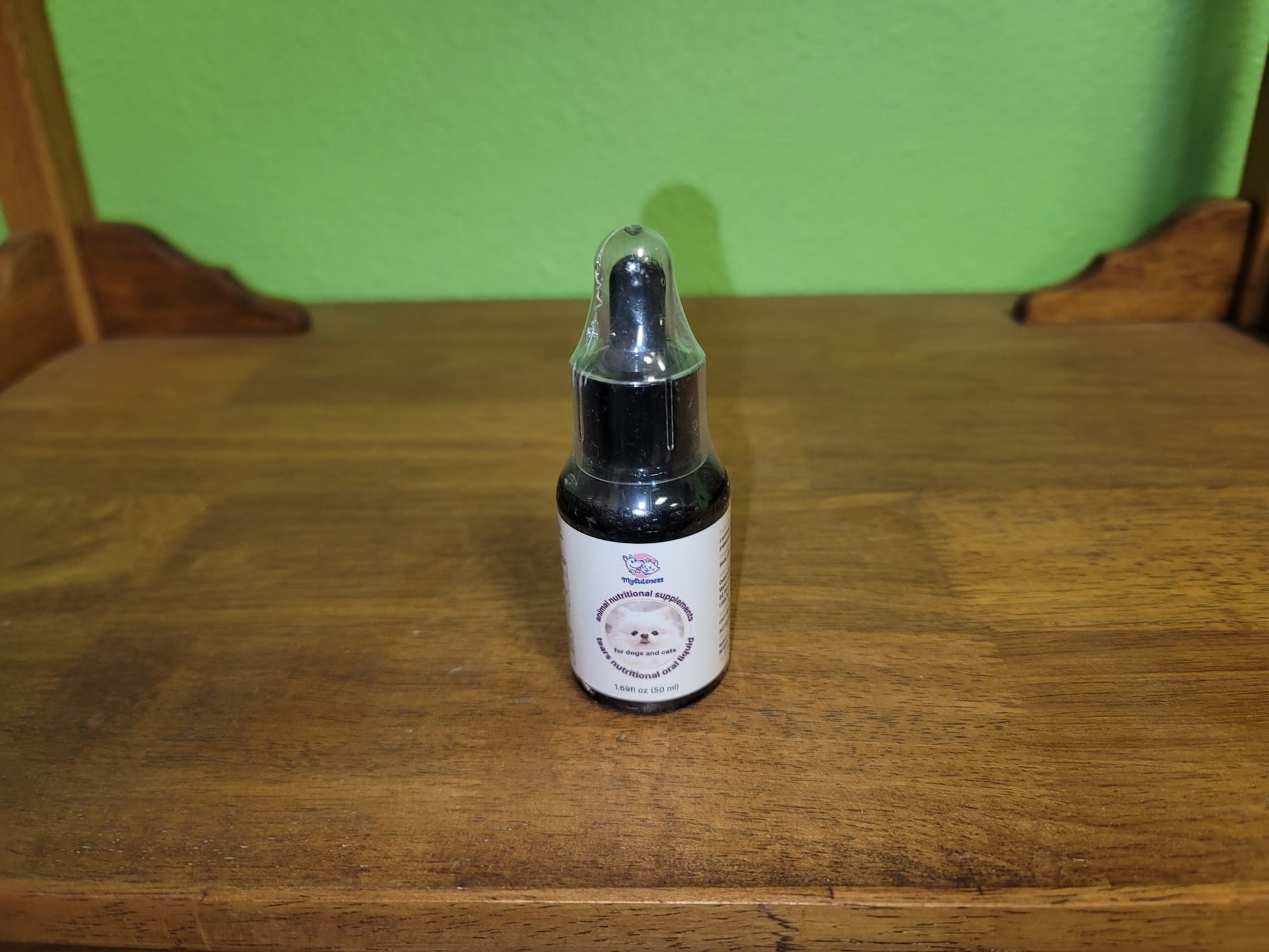 Close‑up of My Cuteness Pet Tear Stain applicator wiping a dog’s eye area